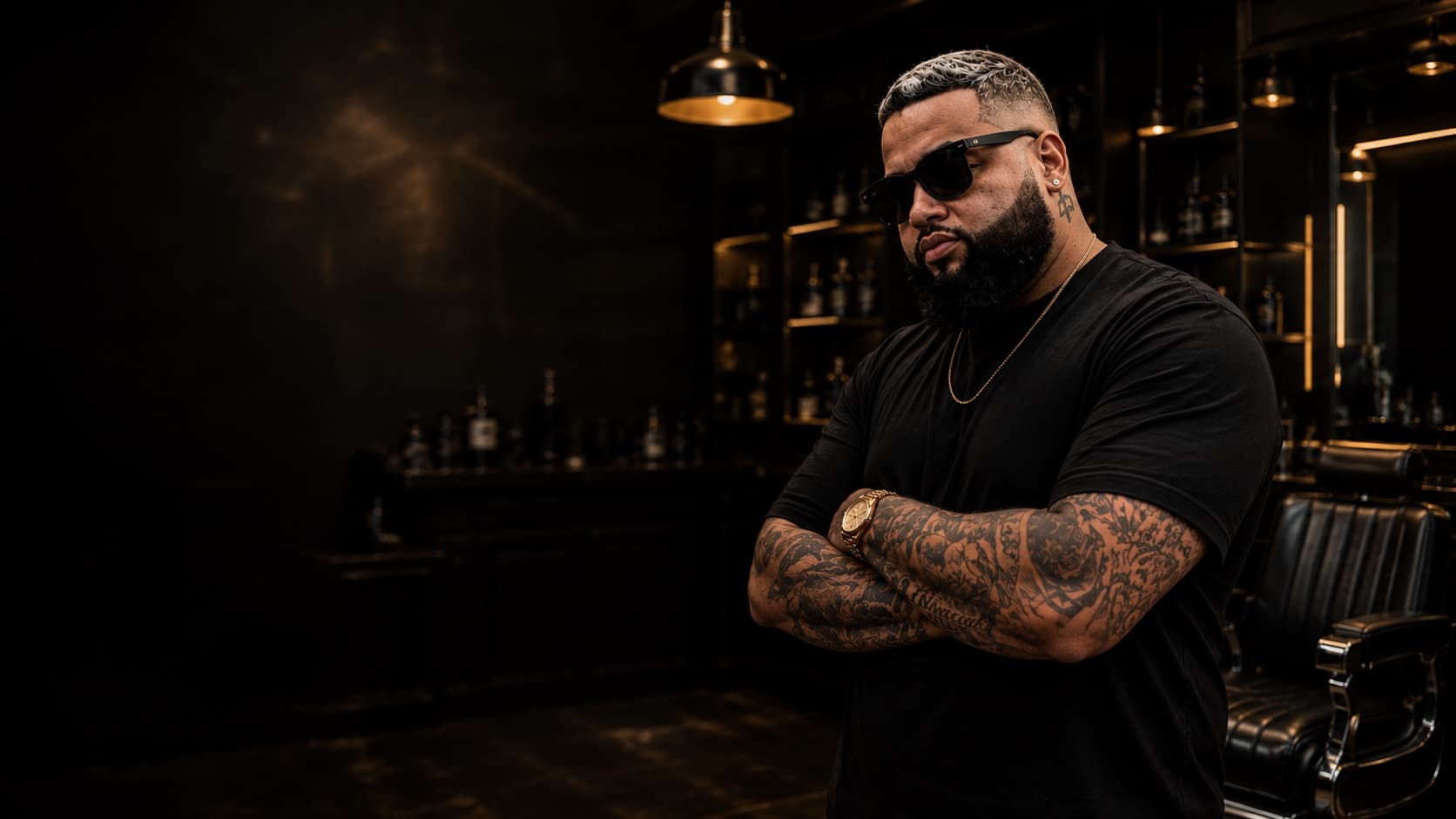 Goldo standing in his barbershop, ready for the next appointment